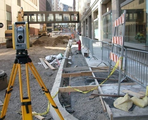 Survey equipment on road under construction