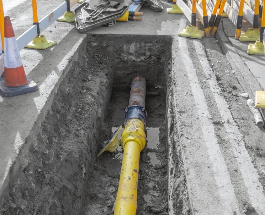 Utility pipe being buried