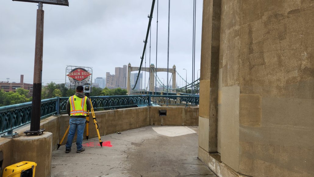 Rani Land Surveyor Minneapolis Hennepin Ave Bridge Land surveyor, Minneapolis, Hennepin Ave Bridge. Conducting boundary survey in Twin Cities.